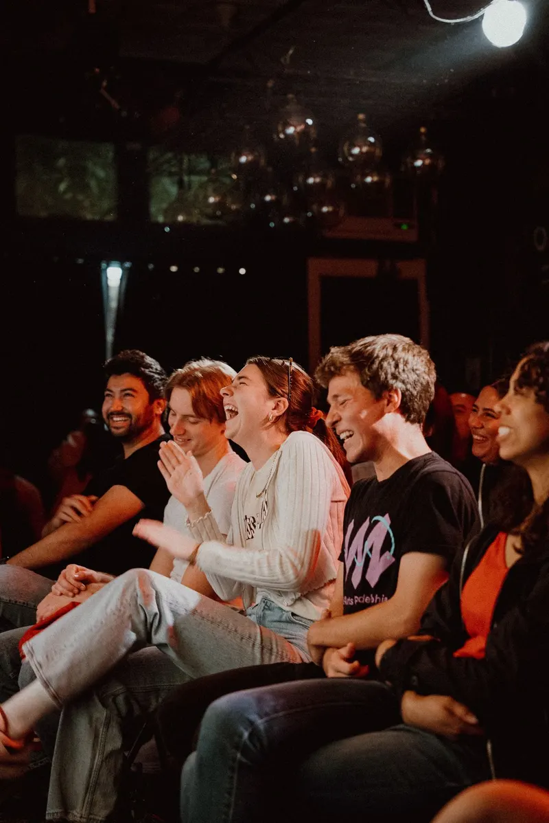 The Room 808 audience laughing